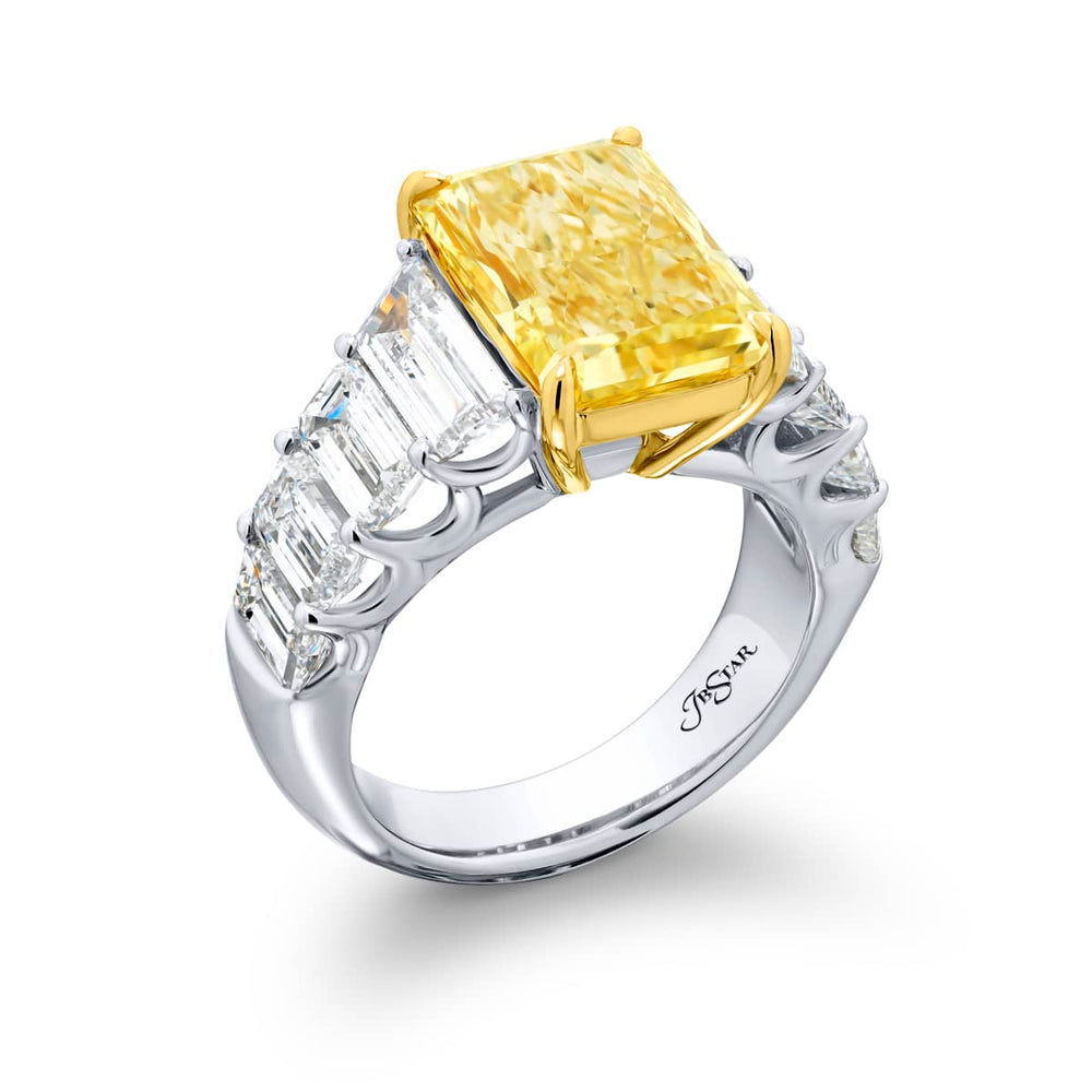Dazzling Brilliance: Our magnificent 5.66 ct. GIA certified Fancy Yellow Diamond Ring. This beautiful radiant-cut fancy yellow diamond flanked by emerald-cut and trapezoid diamonds is handcrafted in pure platinum and 18KY gold.