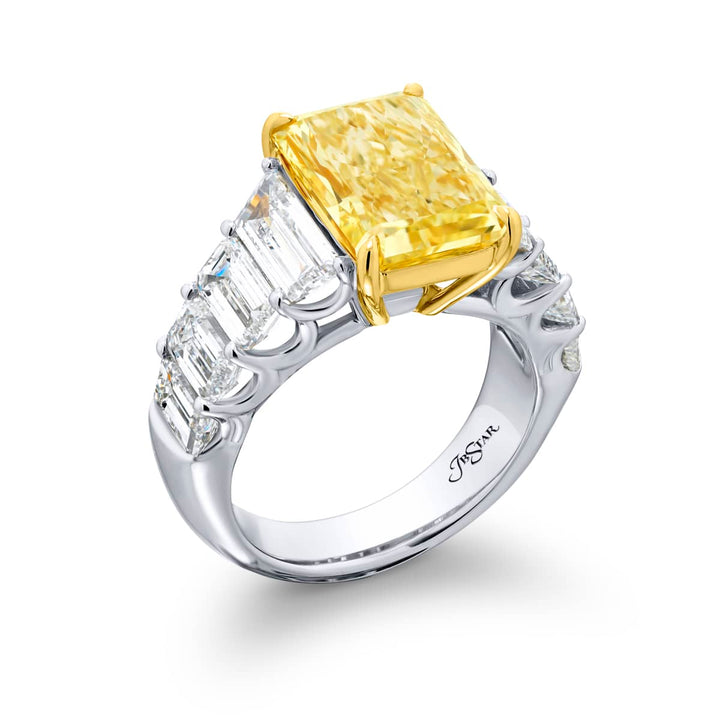 Dazzling Brilliance: Our magnificent 5.66 ct. GIA certified Fancy Yellow Diamond Ring. This beautiful radiant-cut fancy yellow diamond flanked by emerald-cut and trapezoid diamonds is handcrafted in pure platinum and 18KY gold.