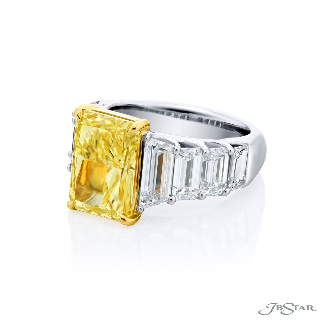 Dazzling Brilliance: Our magnificent 5.66 ct. GIA certified Fancy Yellow Diamond Ring. This beautiful radiant-cut fancy yellow diamond flanked by emerald-cut and trapezoid diamonds is handcrafted in pure platinum and 18KY gold.