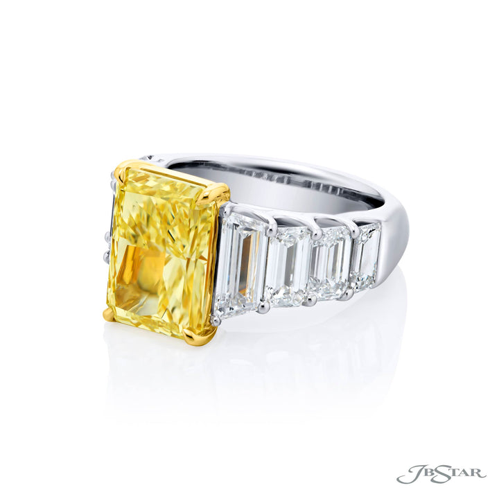 Dazzling Brilliance: Our magnificent 5.66 ct. GIA certified Fancy Yellow Diamond Ring. This beautiful radiant-cut fancy yellow diamond flanked by emerald-cut and trapezoid diamonds is handcrafted in pure platinum and 18KY gold.