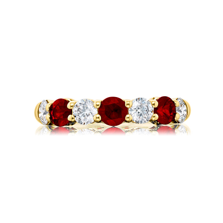 Elegance Elevated: Our classic Ruby and Diamond Band. These beautiful round-cut rubies blended with round-cut diamonds are handcrafted in 18KY gold.