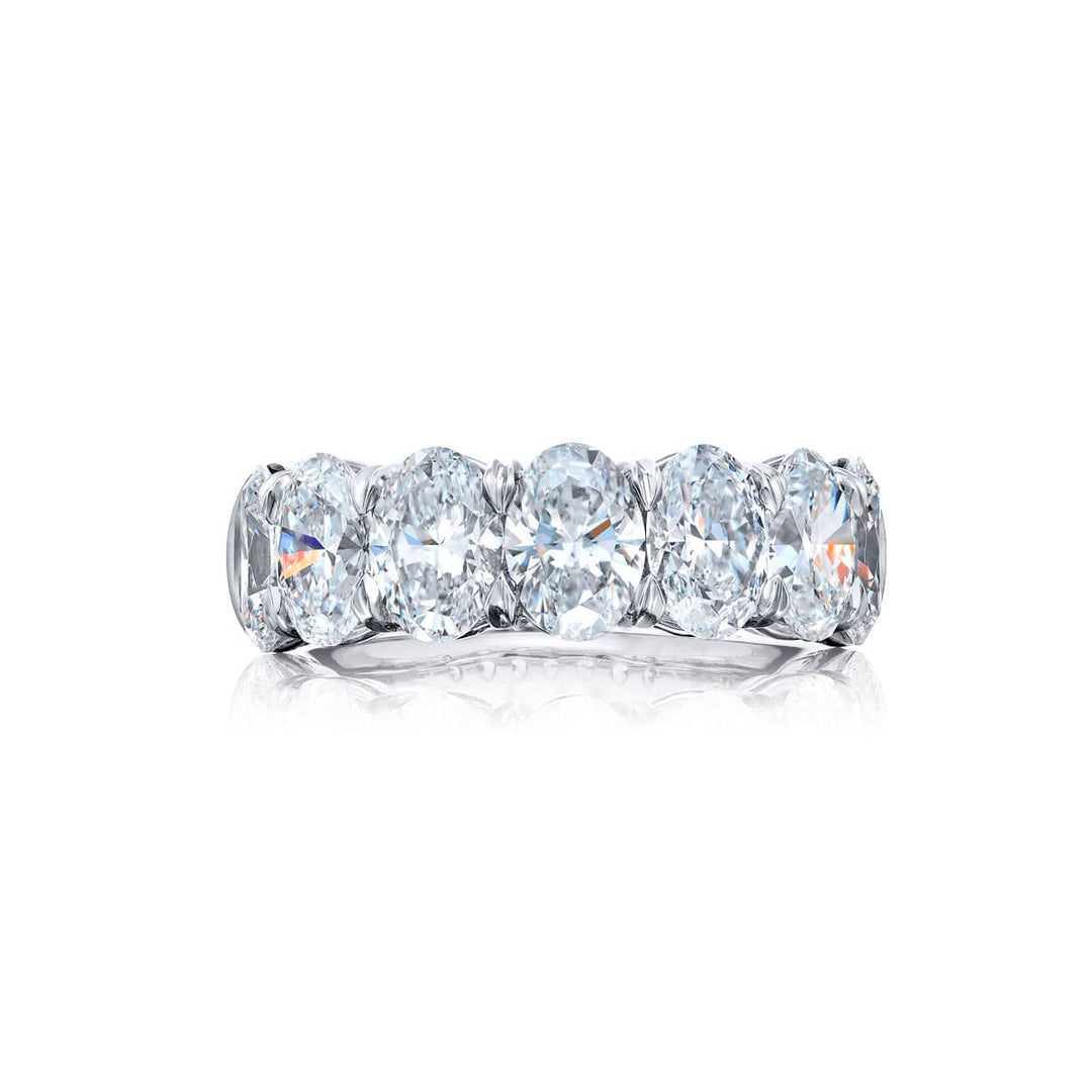 Elegance Elevated: Our signature GIA certified Diamond Band. These seven beautiful oval diamonds are handcrafted in pure platinum.