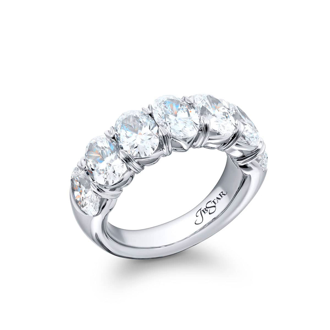Elegance Elevated: Our signature GIA certified Diamond Band. These seven beautiful oval diamonds are handcrafted in pure platinum.