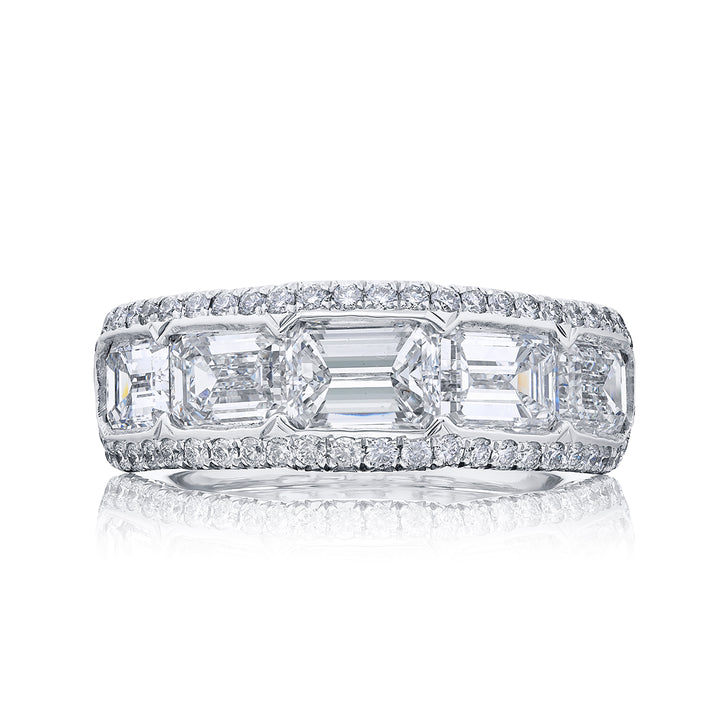 Elegance Elevated: Our signature Bezel East-West Diamond Band. These five gorgeous emerald-cut diamonds embraced by micro pave diamonds are handcrafted in pure platinum.