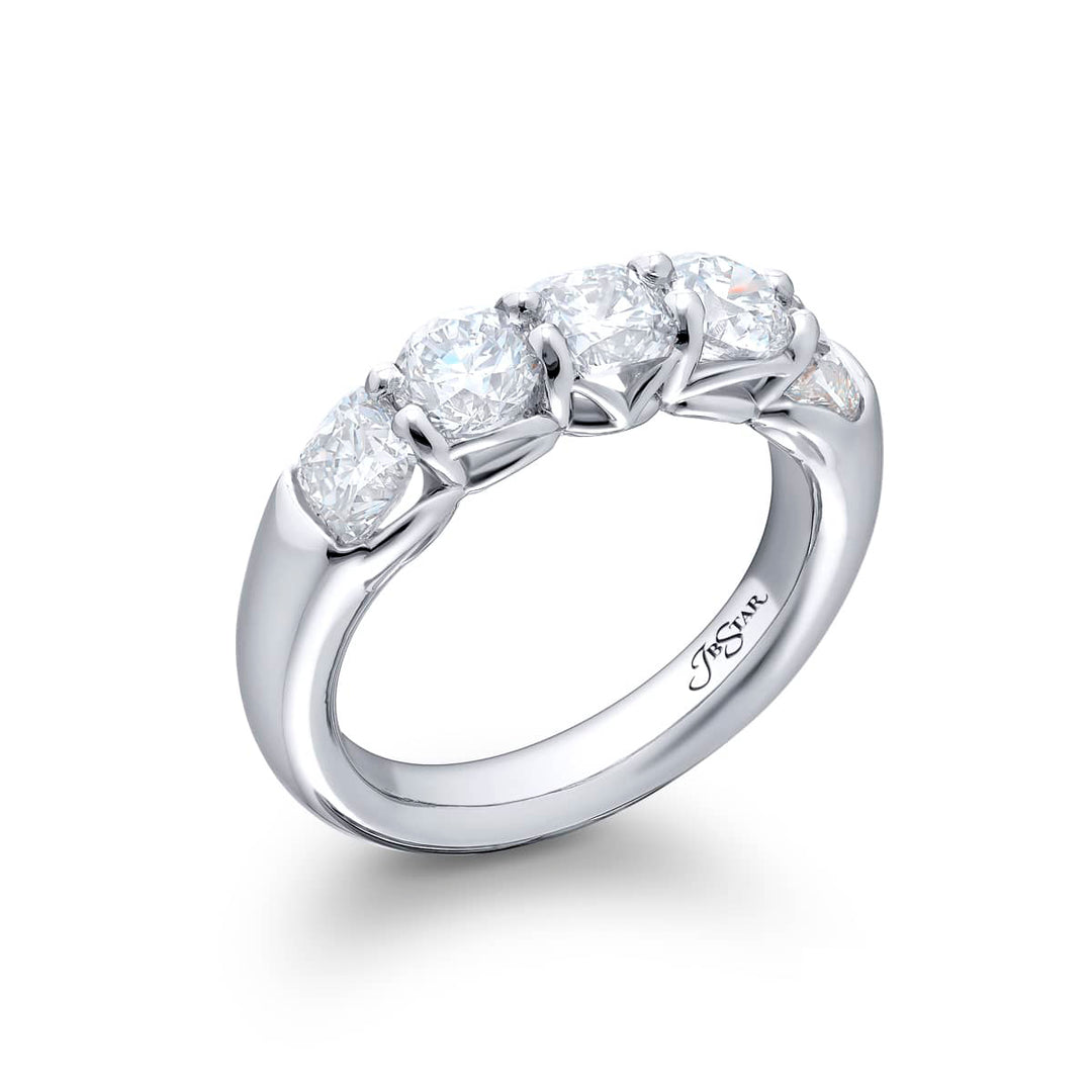 Elegance Elevated: Our classic single row Diamond Band. These stunning cushion-cut and round diamonds are handcrafted in pure platinum.