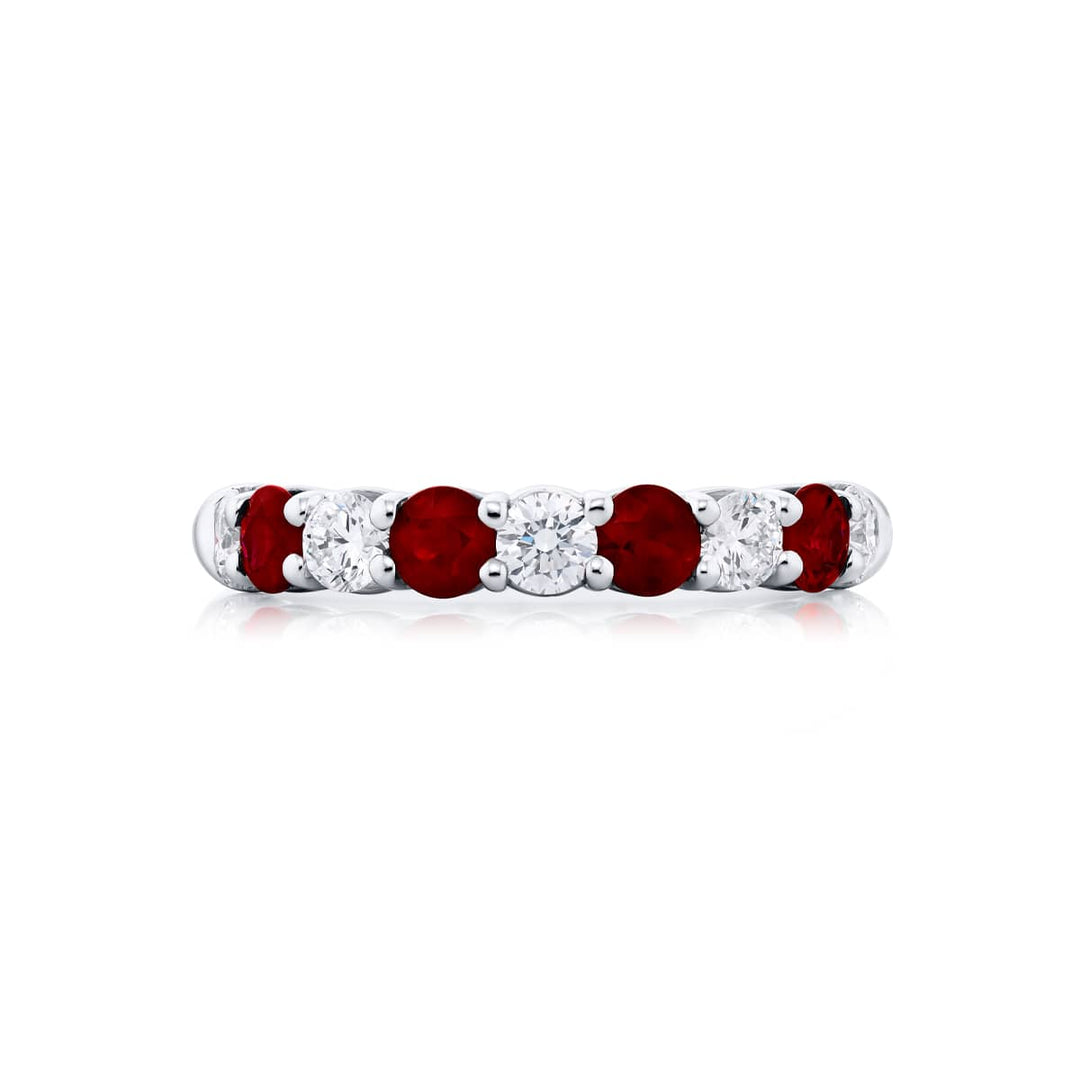 Elegance Elevated: Our stunning single row Ruby Band. These stunning round rubies accompany round diamonds and are handcrafted in pure platinum.