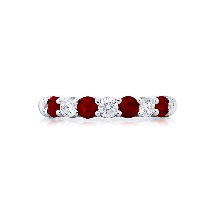 Elegance Elevated: Our stunning single row Ruby Band. These stunning round rubies accompany round diamonds and are handcrafted in pure platinum.