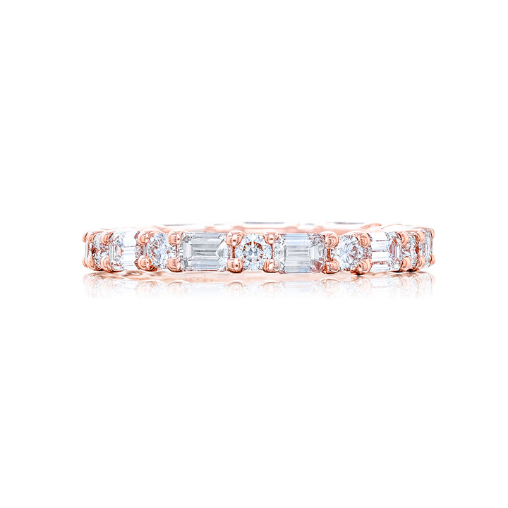 Alluring Eternity: Our stunning single row East-West Diamond Eternity Band. These emerald-cut diamonds blend round diamonds and are handcrafted in 18KY pink gold.