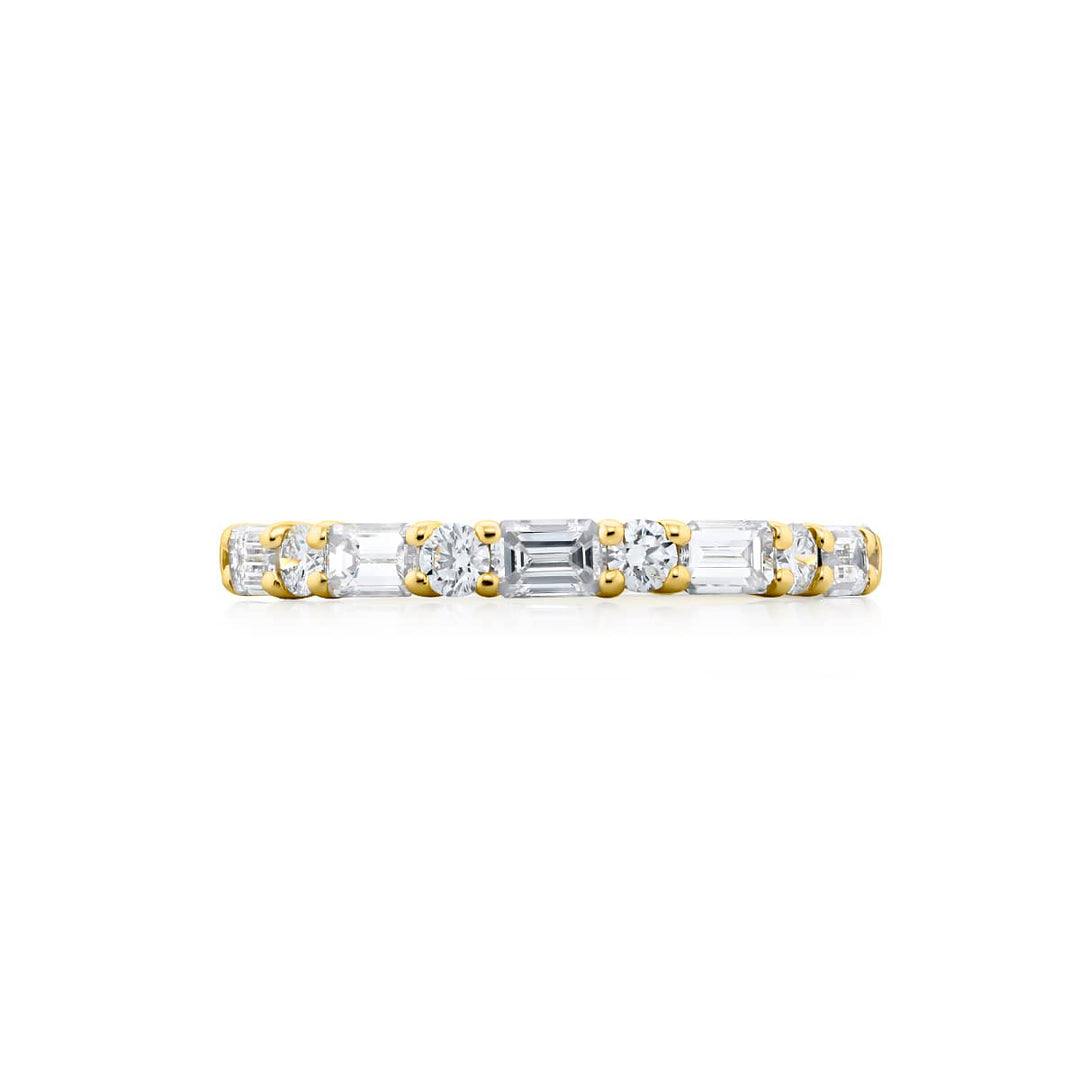 Elegance Elevated: Our signature 1.00 ctw. East-West Diamond Band. These beautiful emerald-cut diamonds blending with round diamonds are handcrafted in 18KY gold.