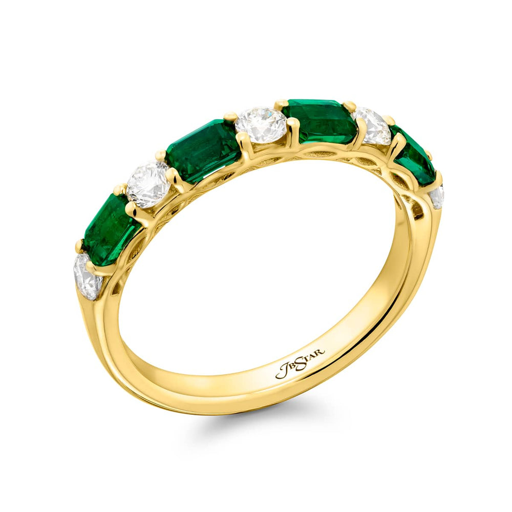Elegance Elevated: Our signature East-West Emerald and Diamond Band. These gorgeous emerald-cut emeralds embraced with round diamonds are handcrafted in 18K yellow gold.