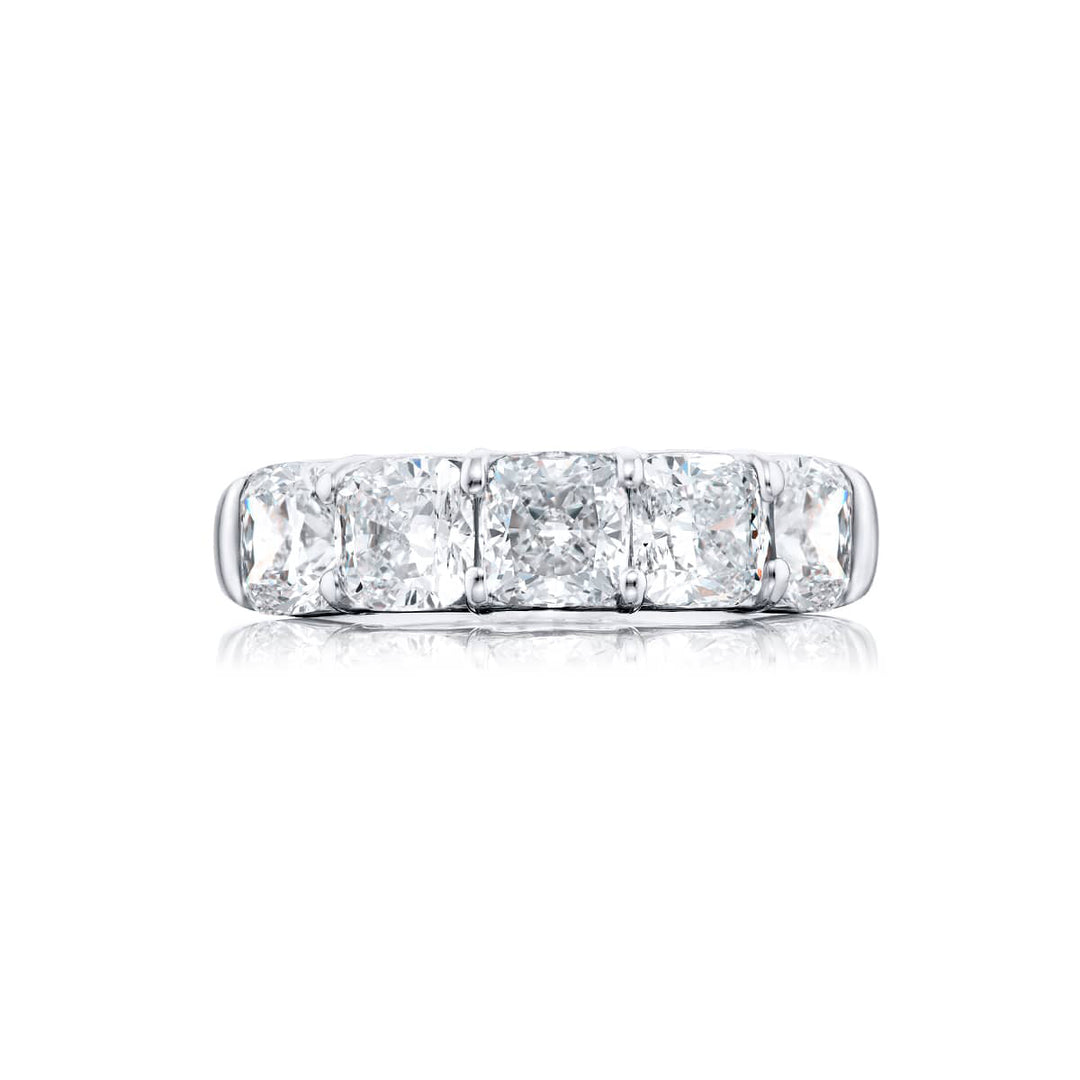 Elegance Elevated: Our classic 4.06 ctw. GIA certified Diamond Band. These five stunning cushion-cut diamonds are handcrafted in pure platinum.