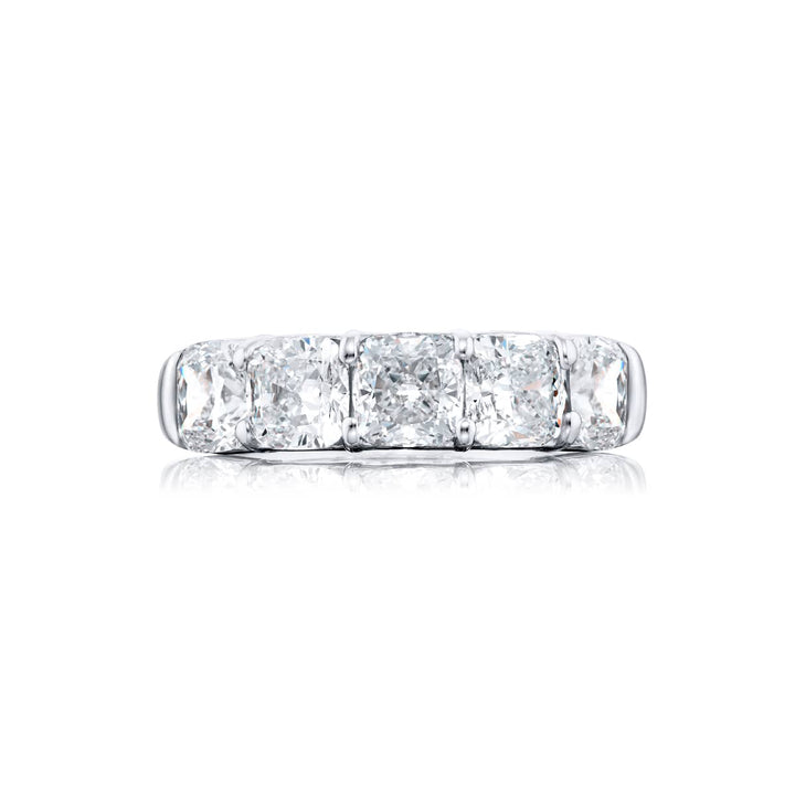 Elegance Elevated: Our classic 4.06 ctw. GIA certified Diamond Band. These five stunning cushion-cut diamonds are handcrafted in pure platinum.