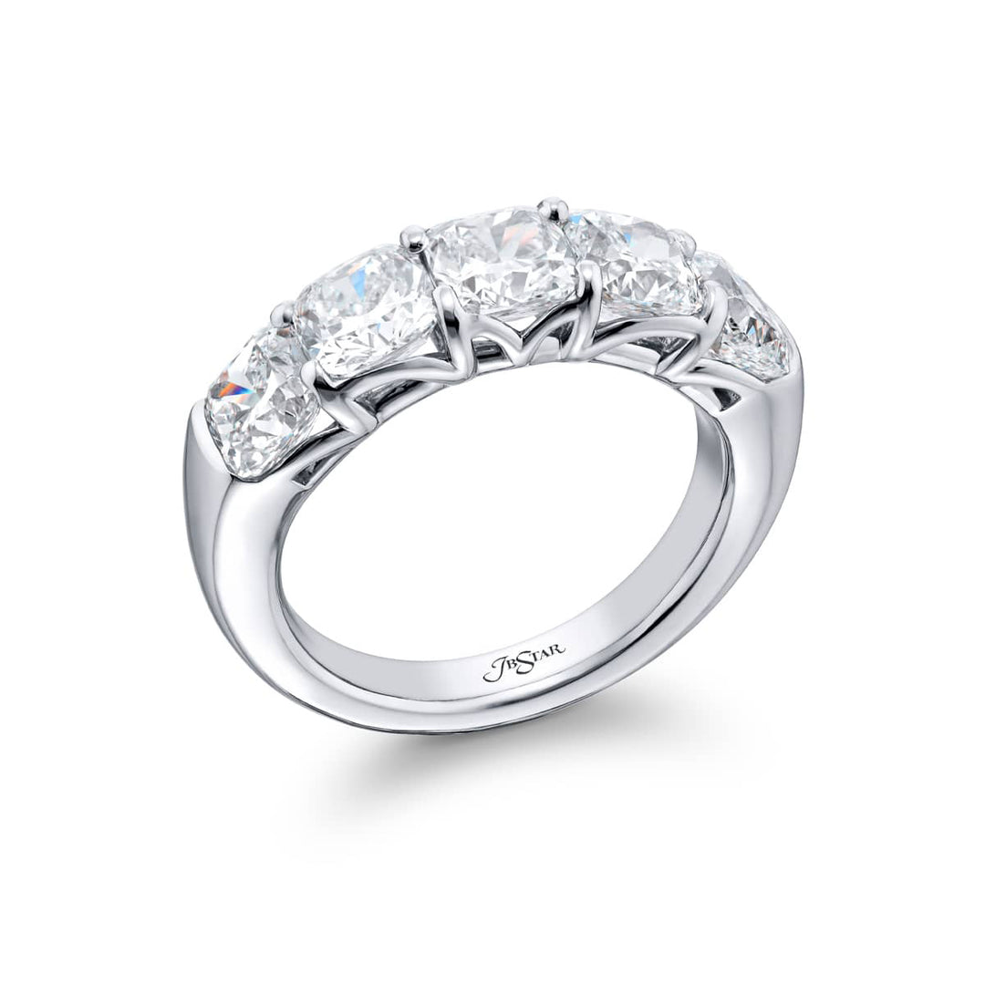 Elegance Elevated: Our classic 4.06 ctw. GIA certified Diamond Band. These five stunning cushion-cut diamonds are handcrafted in pure platinum.