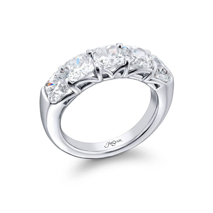 Elegance Elevated: Our classic 4.06 ctw. GIA certified Diamond Band. These five stunning cushion-cut diamonds are handcrafted in pure platinum.