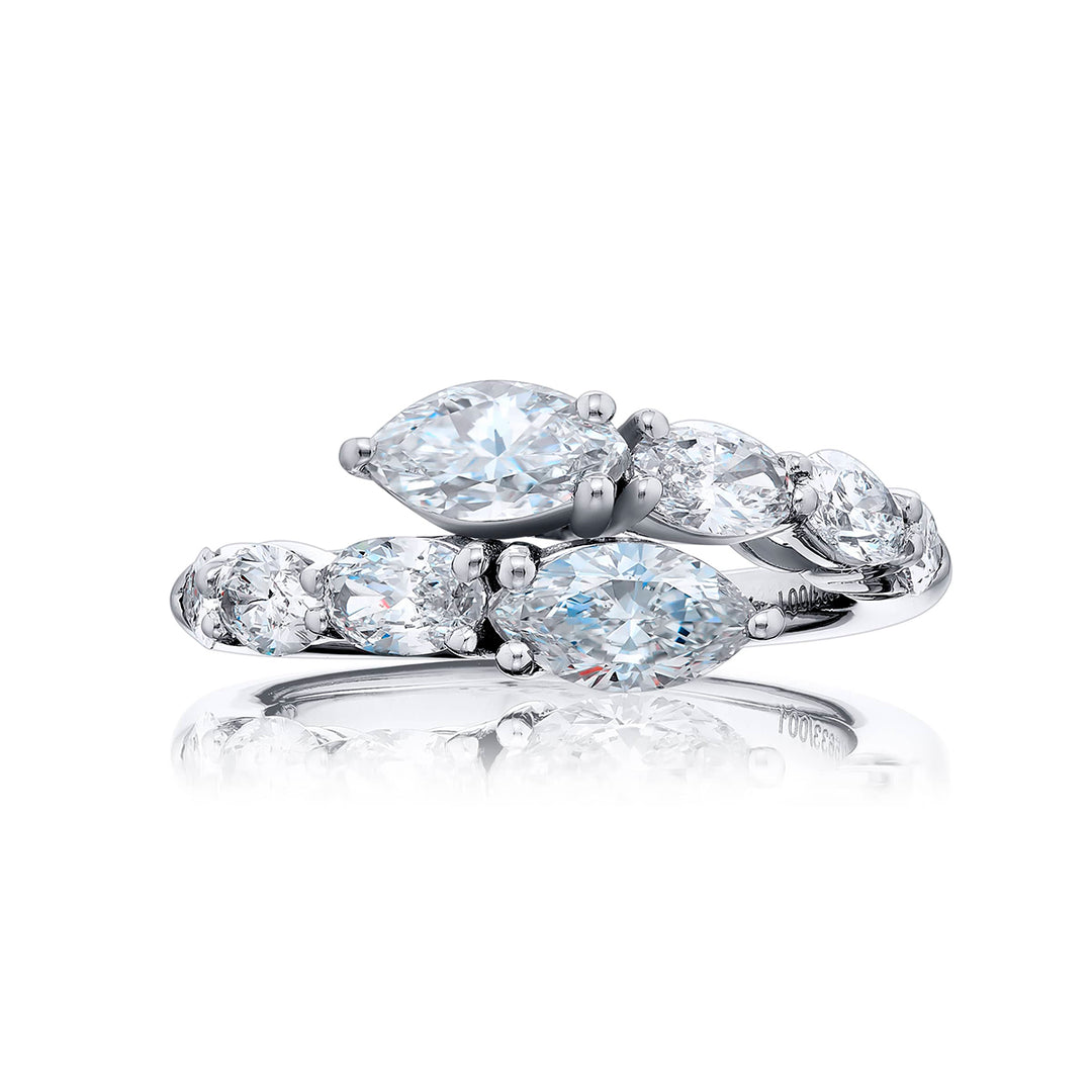 Dazzling Brilliance: Our signature Twogether Diamond Ring. These stunning pear-shaped diamonds accompanied by oval and marquise diamonds are handcrafted in pure platinum.