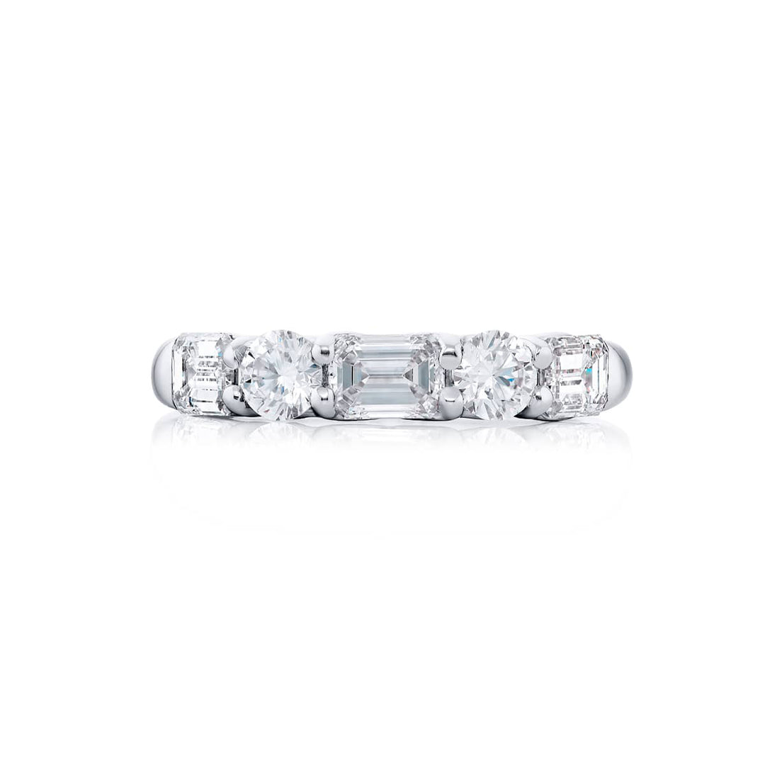 Elegance Elevated: Our classic single row East-West Diamond Band. These emerald-cut diamonds accompany round diamonds and are handcrafted in pure platinum.