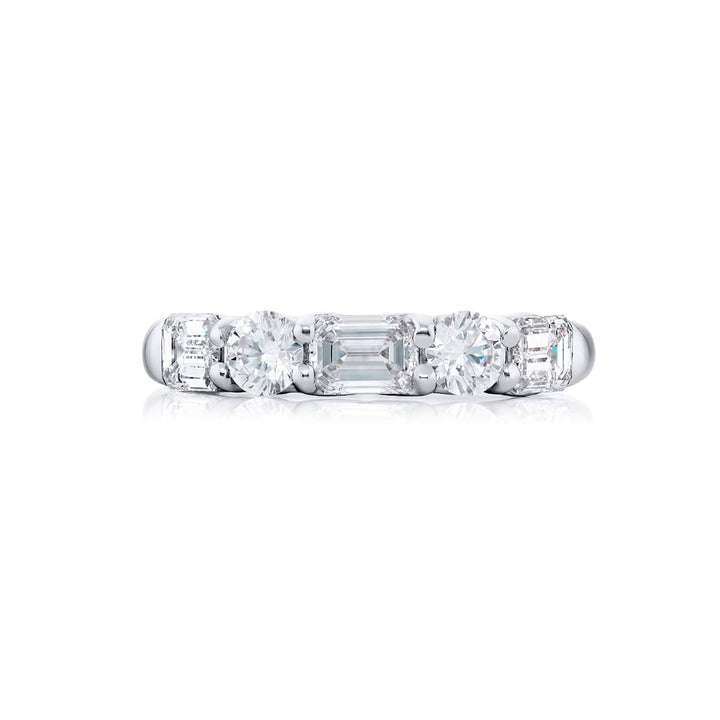Elegance Elevated: Our classic single row East-West Diamond Band. These emerald-cut diamonds accompany round diamonds and are handcrafted in pure platinum.