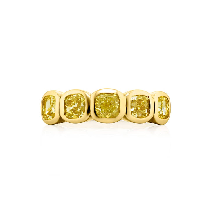 Elegance Elevated: Our stunning 2.31 ctw. Bezel Fancy Yellow Diamond Band. These five beautiful cushion-cut fancy yellow diamonds are handcrafted in 18KY gold.