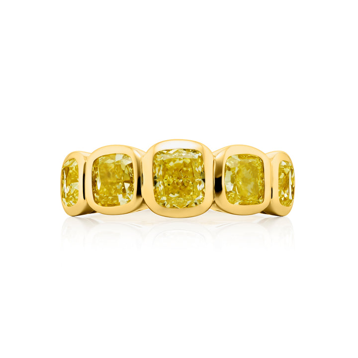 Elegance Elevated: Our stunning 3.55 ctw. Bezel Fancy Yellow Diamond Band. These five beautiful cushion-cut fancy yellow diamonds are handcrafted in 18KY gold.