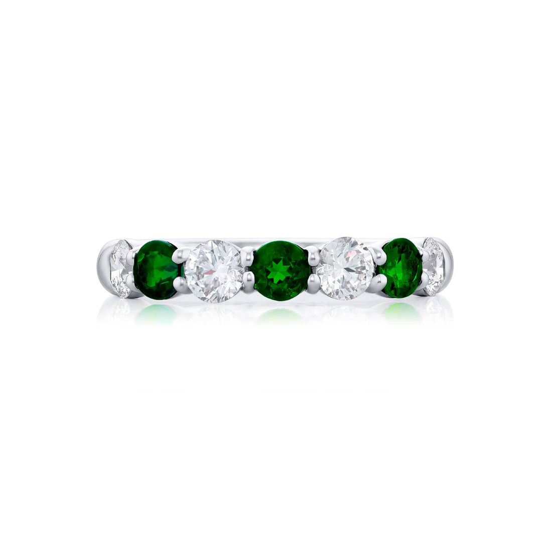 Elegance Elevated: Our signature  Emerald and Diamond Band. These beautiful round emeralds blended with round diamonds are handcrafted in pure platinum.