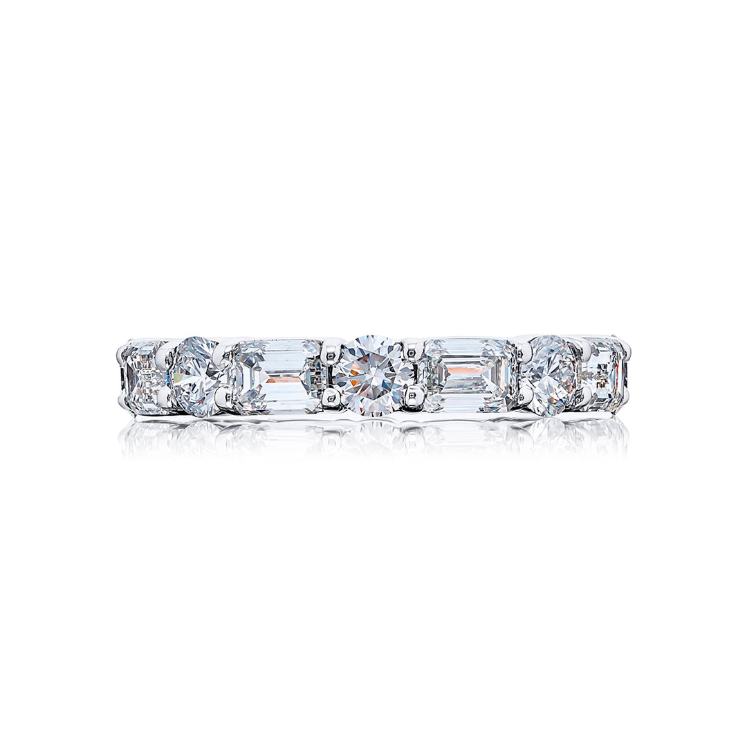 Alluring Eternity: Our stunning single row East-West Diamond Eternity Band. These sixteen emerald-cut and round diamonds are handcrafted in pure platinum.