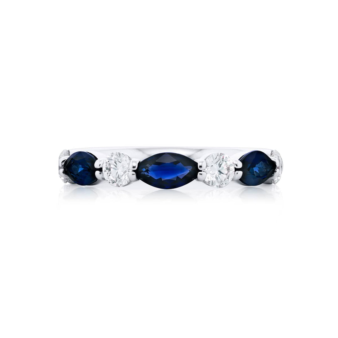 Elegance Elevated: Our signature East-West Sapphire Band. These beautiful marquise sapphires blended with dazzling round diamonds are handcrafted in pure platinum.