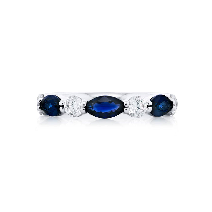 Elegance Elevated: Our signature East-West Sapphire Band. These beautiful marquise sapphires blended with dazzling round diamonds are handcrafted in pure platinum.
