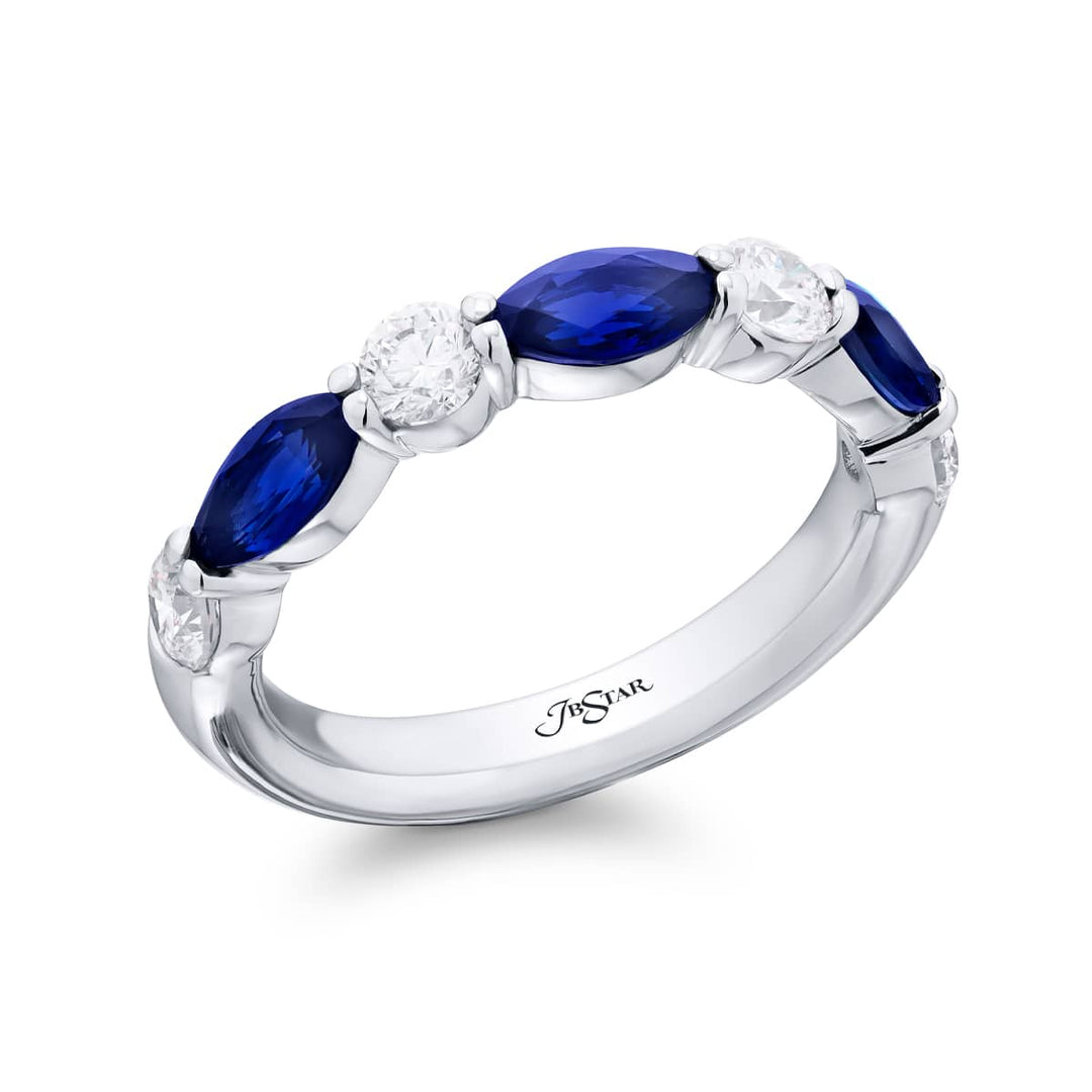 Elegance Elevated: Our signature East-West Sapphire Band. These beautiful marquise sapphires blended with dazzling round diamonds are handcrafted in pure platinum.