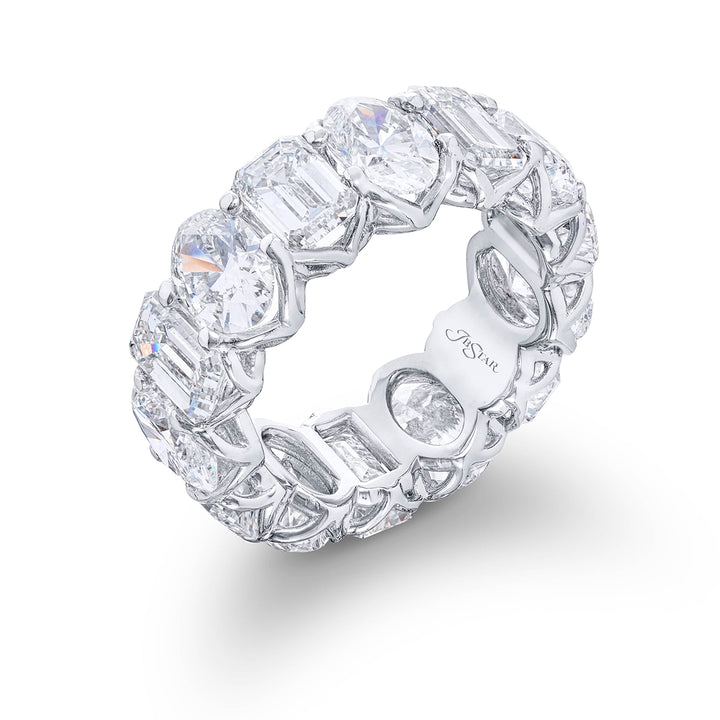 Beautiful eternity band featuring 7 emerald-cut and 7 oval diamonds in a shared prong setting. Handcrafted in pure platinum.