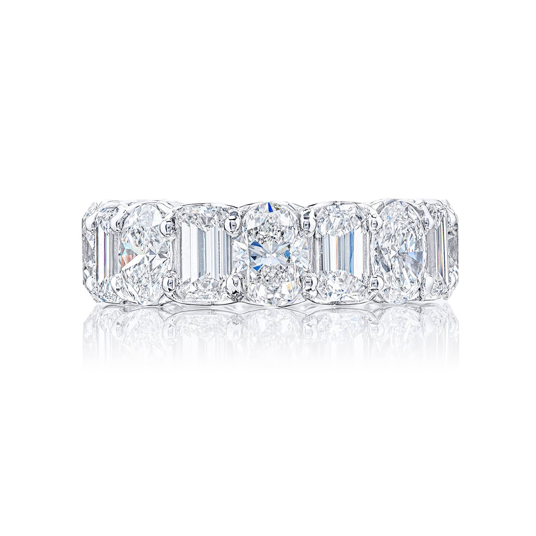 Beautiful eternity band featuring 8 emerald-cut and 8 oval diamonds in a shared prong setting. Handcrafted in pure platinum.