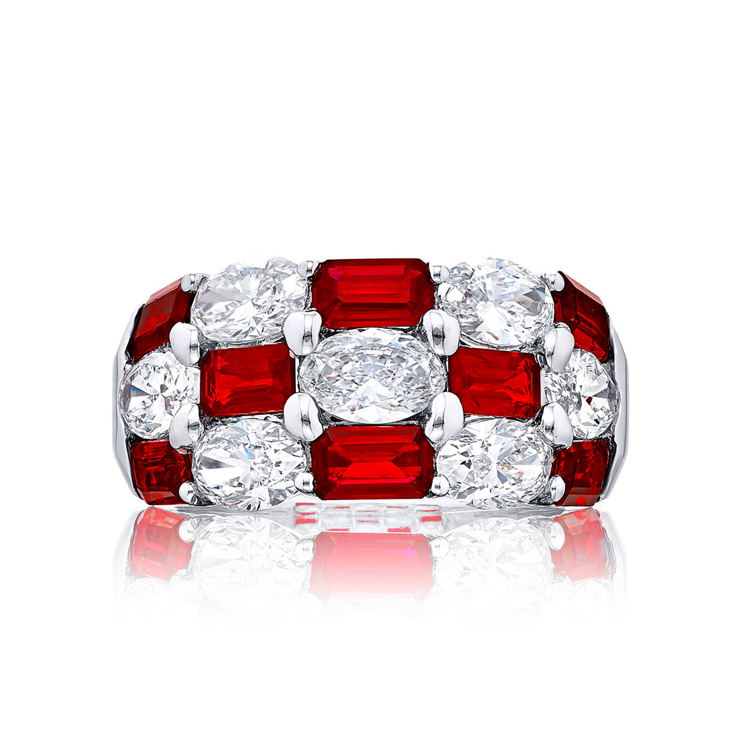 Elegance Elevated: Our iconic three-row Ruby and Diamond Band. These alternating emerald-cut rubies blend with oval diamonds and are handcrafted in pure platinum.