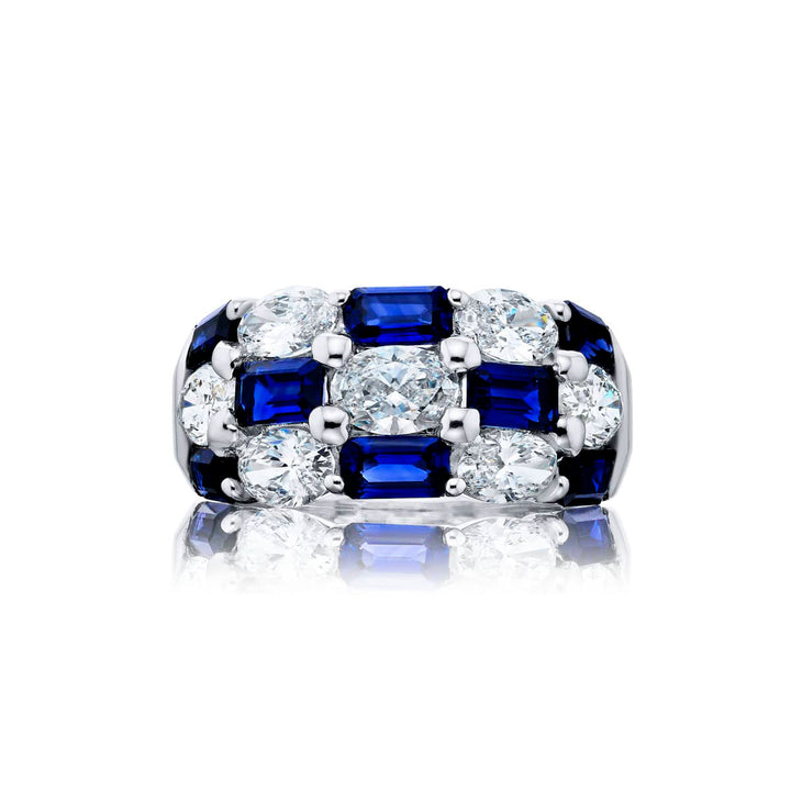 Elegance Elevated: Our signature Three-Row Sapphire Band. These gorgeous emerald-cut sapphires cradled in oval diamonds are handcrafted in pure platinum.