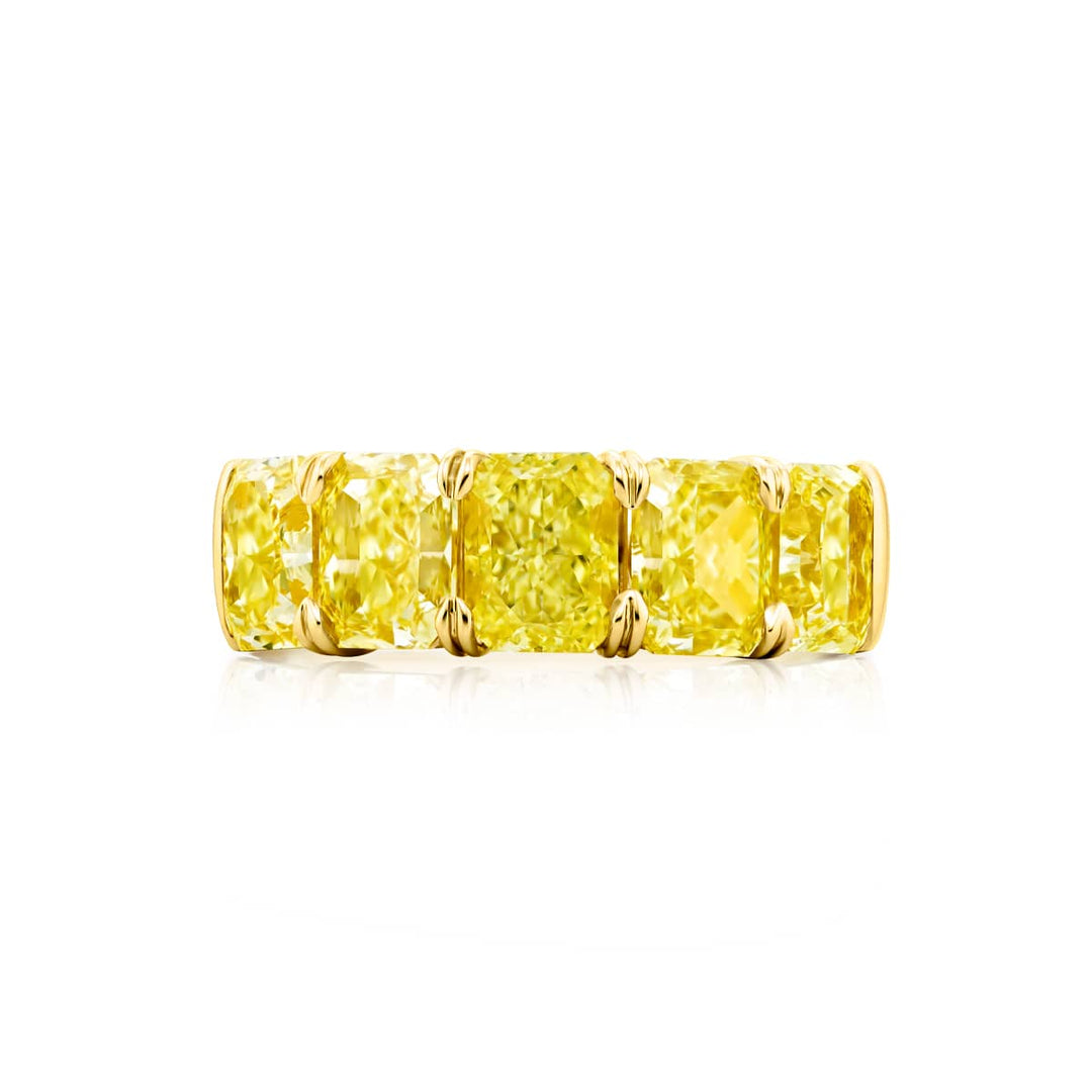 Elegance Elevated: Our stunning 5.05 ctw. GIA certified Fancy Yellow Diamond Band. These five beautiful radiant-cut fancy yellow diamonds are handcrafted in 18KY gold.