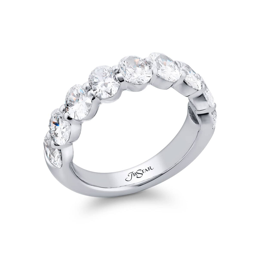 Elegance Elevated: Our classic single row 2.72 ctw. Diamond Band. These nine stunning oval diamonds are handcrafted in pure platinum.