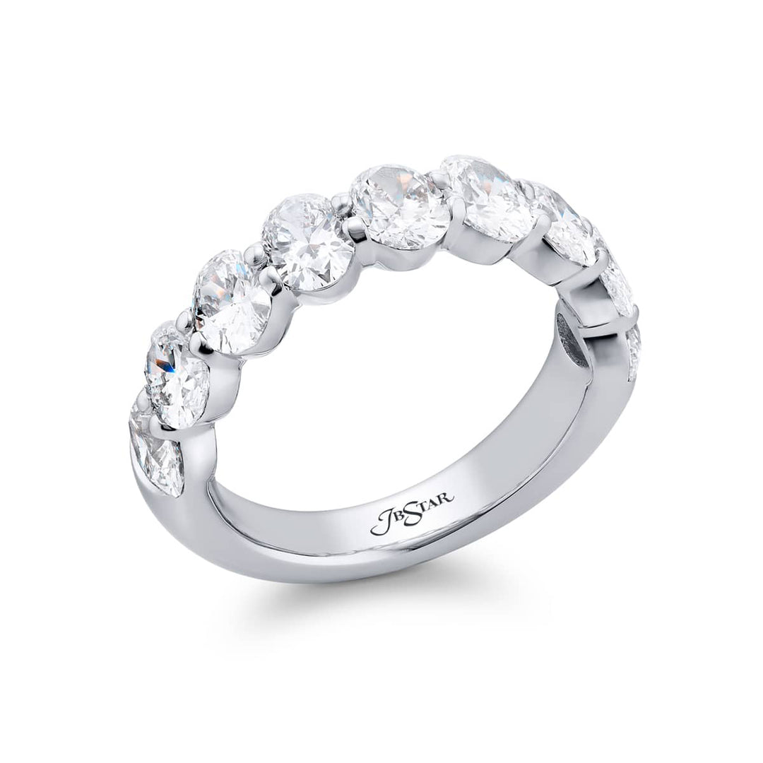 Elegance Elevated: Our classic single row 2.72 ctw. Diamond Band. These nine stunning oval diamonds are handcrafted in pure platinum.