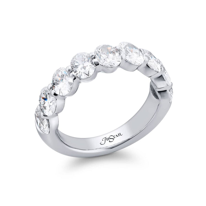 Elegance Elevated: Our classic single row 2.72 ctw. Diamond Band. These nine stunning oval diamonds are handcrafted in pure platinum.