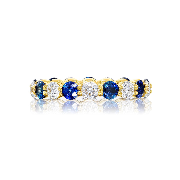 Alluring Eternity: Our beautiful single row Sapphire and Diamond Eternity Band. These stunning round sapphires blend with round diamonds and are handcrafted in 18KY gold.