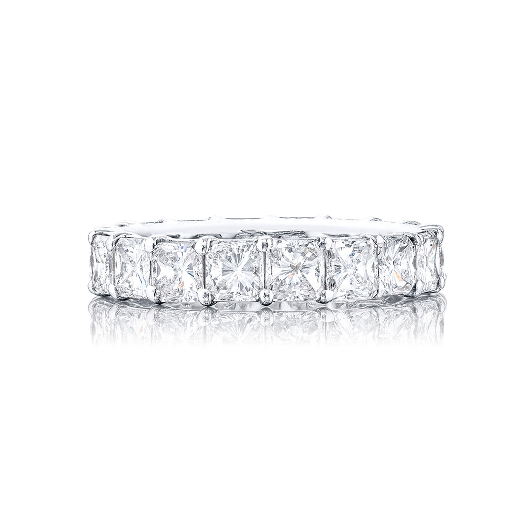 This stunning eternity band a testament to eternal love and devotion. Crafted from pure platinum it boasts 18 impeccably matched radiant diamonds. Each of these exquisite diamonds is secured with shared prongs