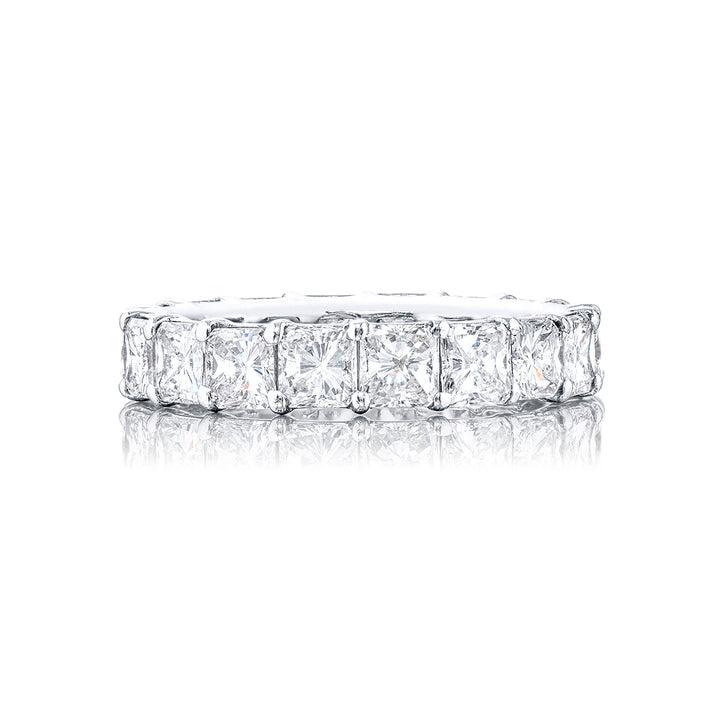 This stunning eternity band a testament to eternal love and devotion. Crafted from pure platinum it boasts 18 impeccably matched radiant diamonds. Each of these exquisite diamonds is secured with shared prongs