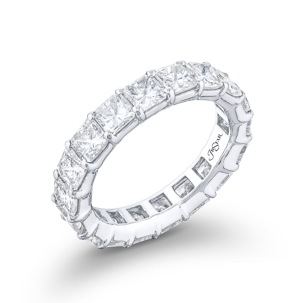 This stunning eternity band a testament to eternal love and devotion. Crafted from pure platinum it boasts 18 impeccably matched radiant diamonds. Each of these exquisite diamonds is secured with shared prongs