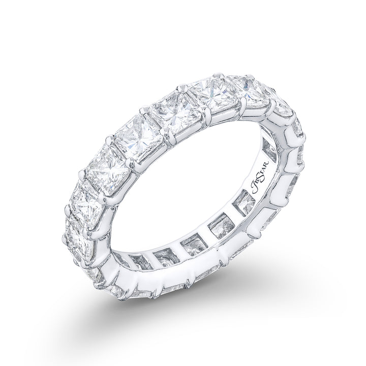 This stunning eternity band a testament to eternal love and devotion. Crafted from pure platinum it boasts 18 impeccably matched radiant diamonds. Each of these exquisite diamonds is secured with shared prongs