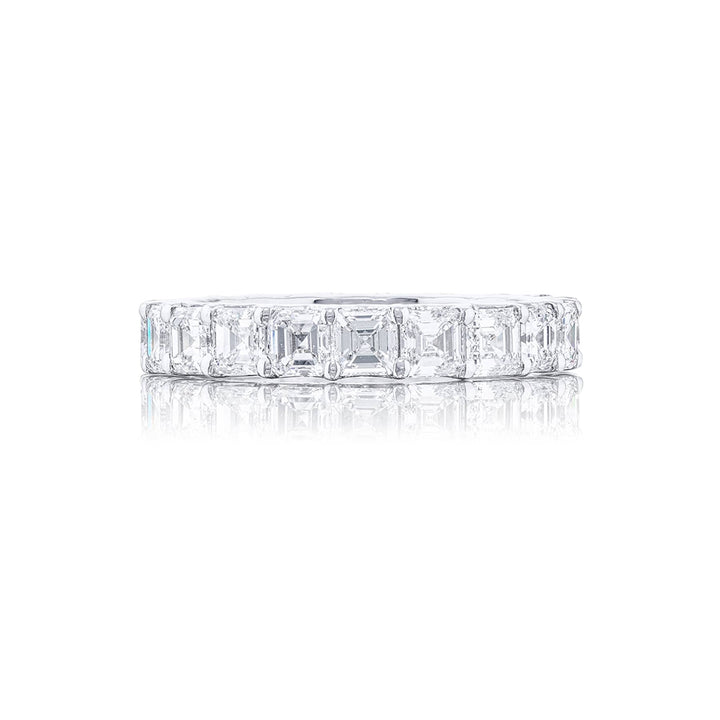 Stunning diamond eternity band featuring 20 perfectly matched square emerald-cut diamonds. Handcrafted in pure platinum.