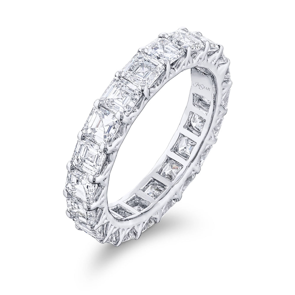 Stunning diamond eternity band featuring 20 perfectly matched square emerald-cut diamonds. Handcrafted in pure platinum.
