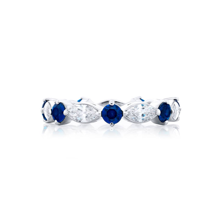 Alluring Eternity: Our beautiful single-row Sapphire Eternity Band. These stunning round sapphires blend with marquise diamonds and are handcrafted in pure platinum.