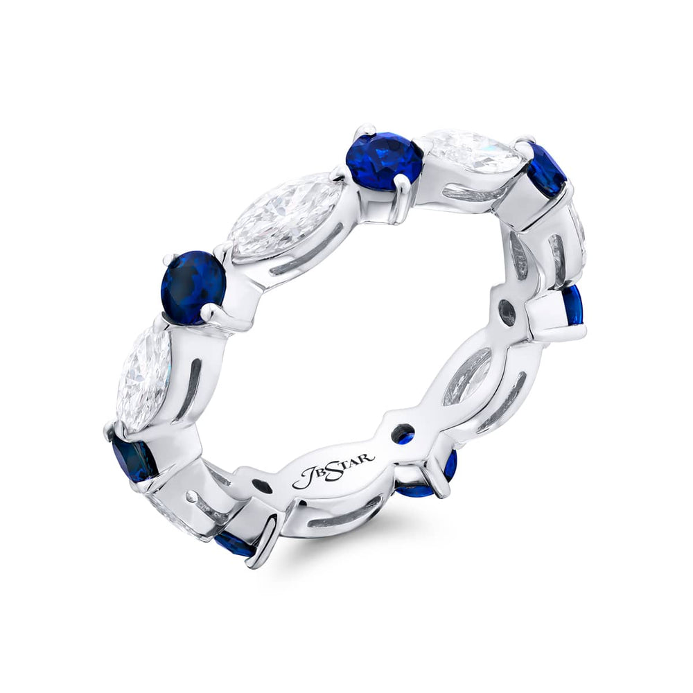 Alluring Eternity: Our beautiful single-row Sapphire Eternity Band. These stunning round sapphires blend with marquise diamonds and are handcrafted in pure platinum.