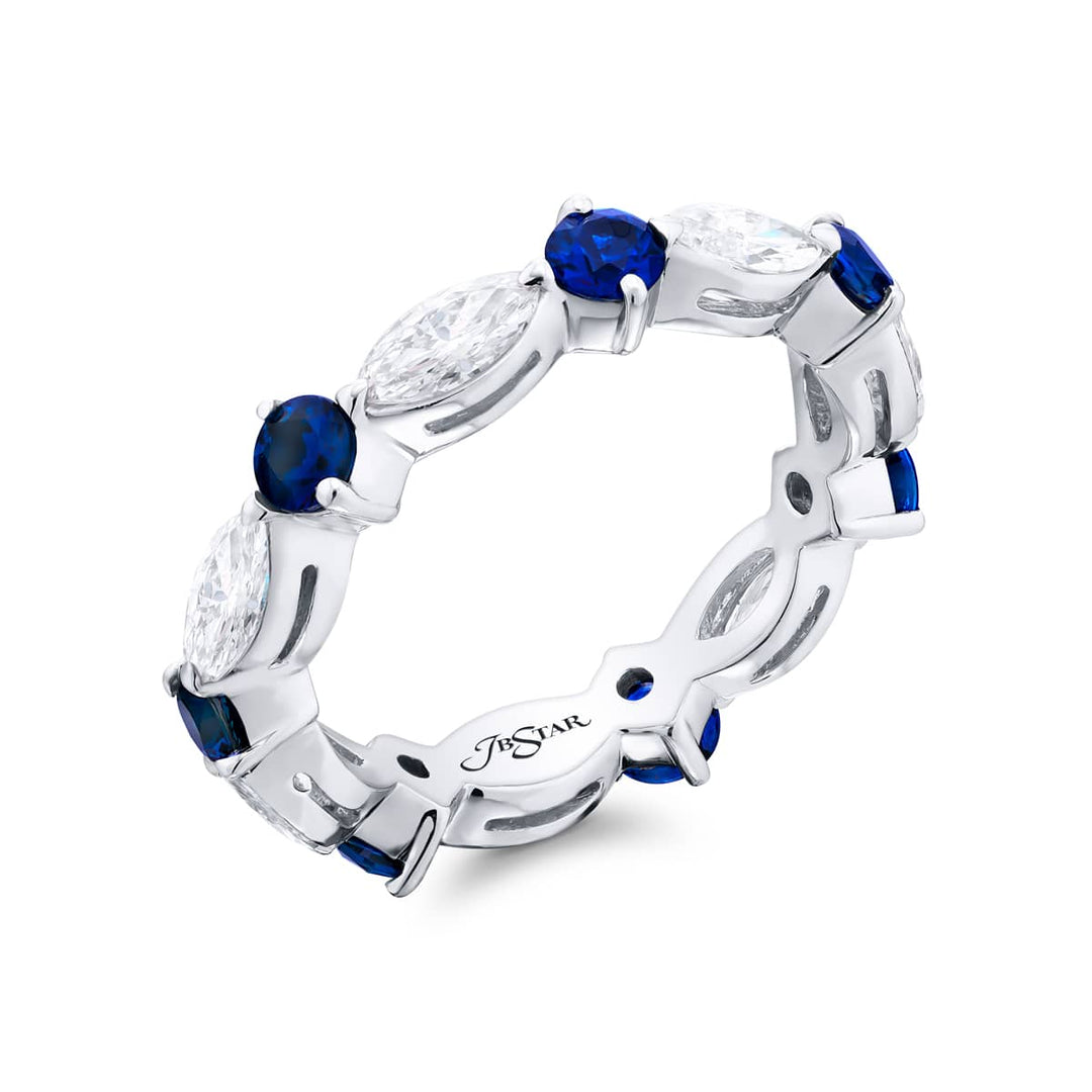 Alluring Eternity: Our beautiful single-row Sapphire Eternity Band. These stunning round sapphires blend with marquise diamonds and are handcrafted in pure platinum.