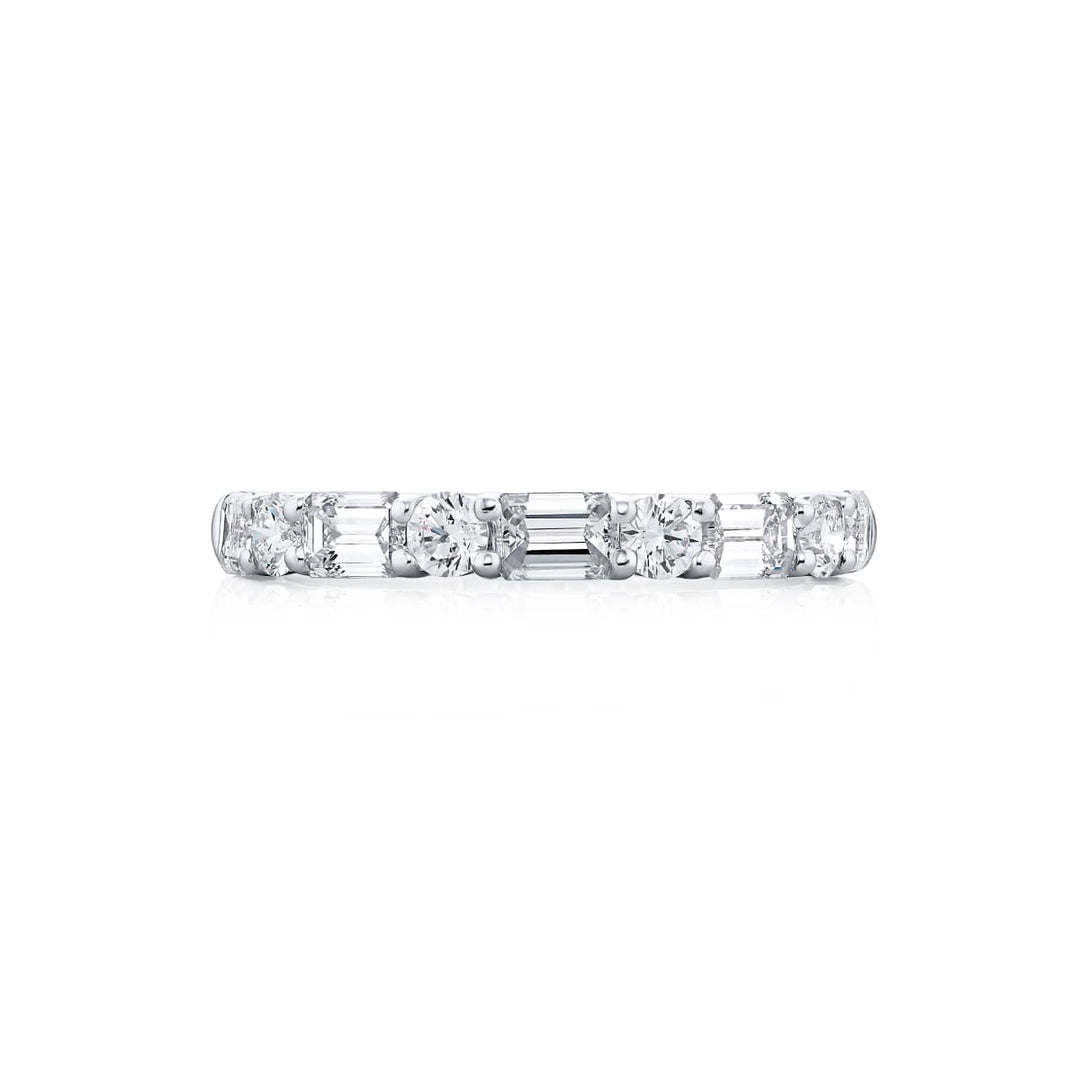 Elegance Elevated: Our classic East-West single row Diamond Band. These stunning straight baguette and round diamonds are handcrafted in pure platinum.