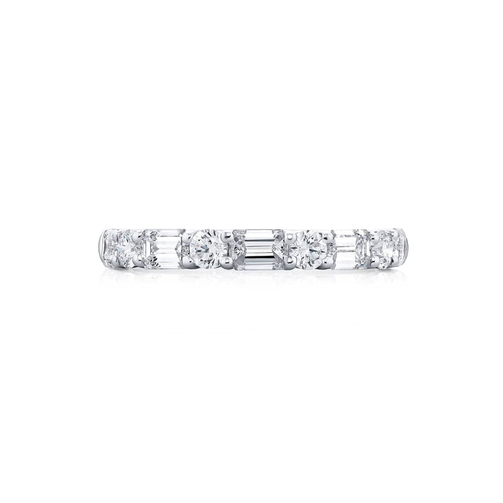 Elegance Elevated: Our classic East-West single row Diamond Band. These stunning straight baguette and round diamonds are handcrafted in pure platinum.