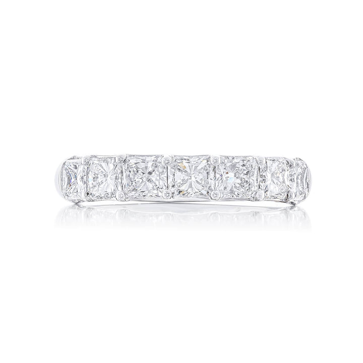 Beautiful diamond wedding band featuring 7 perfectly matched radiant-cut diamonds in a shared prong setting. Handcrafted in pure platinum.