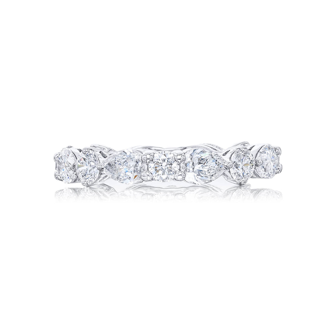 Stunning diamond eternity band featuring 8 round and 8 pear shaped-cut diamonds in a shared prong setting. Handcrafted in pure platinum.